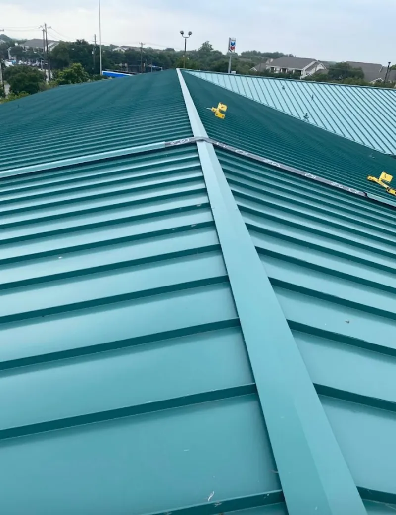 Green commercial metal roof ridge and valley for Metal Roof Repair in Homewood